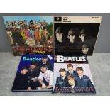 2 beatles LP records, with the beatles and sgt peppers lonely hearts club band plus 2 hardbacked