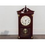 A REPRODUCTION mahogany wall clock.an emperor quartz west minister chime