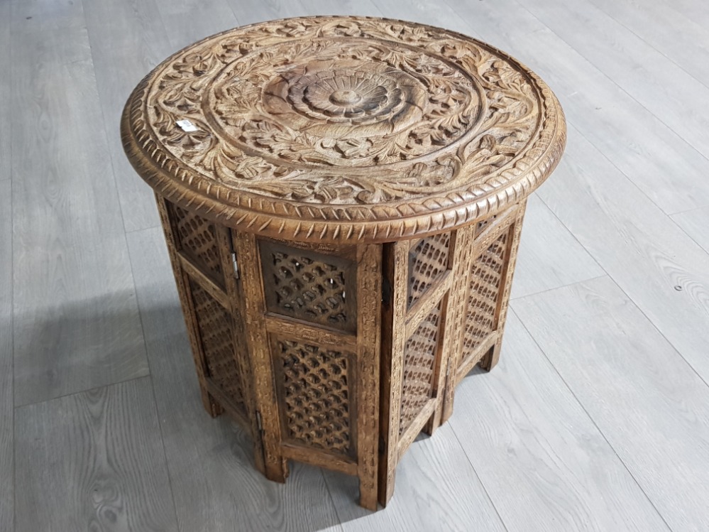 Highly carved asian/eastern Occasional table collapsable with round top