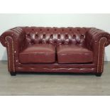 Two seater sofa great condition .ox red made from leather.