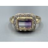 Stunning ladies 9ct gold square shaped cluster ring. Featuring purple and white stone surrounded