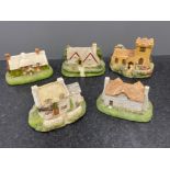 5 miniature pottery houses and church