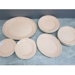 25 pieces of Poole pottery dinnerware, all plates , 6 different sizes in peach