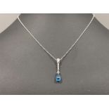 9ct white gold Diamond pendant. Comprising of 3 round brilliant cut diamonds and large blue pear