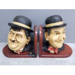 Pair of resin figural bookends on wooden bases, Stan Laurel and Oliver Hardy, height 18cm
