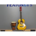 A guitar from music alley along with african style drum etc