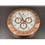Rose gold colour wall clock in the style of Rolex Daytona. 34cms