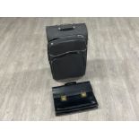 Travel case and black leather briefcase