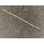 Ladies 9ct white and yellow gold ornate Diamond bracelet. Featuring 7 round brilliant cut diamonds