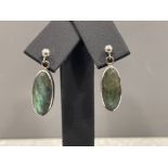 Ladies 9ct white gold green stone drop earrings