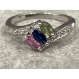 Ladies 9ct white gold old ornate stone set ring. Diamonds, pink, blue and peridot marquise stones.