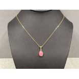 Ladies 9ct gold Pink stone pendant and chain.