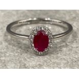 18ct white gold Ruby and Diamond ring. .55cts size O