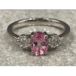 Ladies 9ct white gold Pink topaz and Diamond ring. Comprising of a Oval pink topaz set with 7