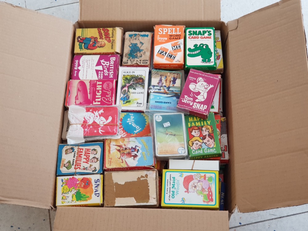 Box containing a large quantity of vintage playing cards, most in original cardboard packs