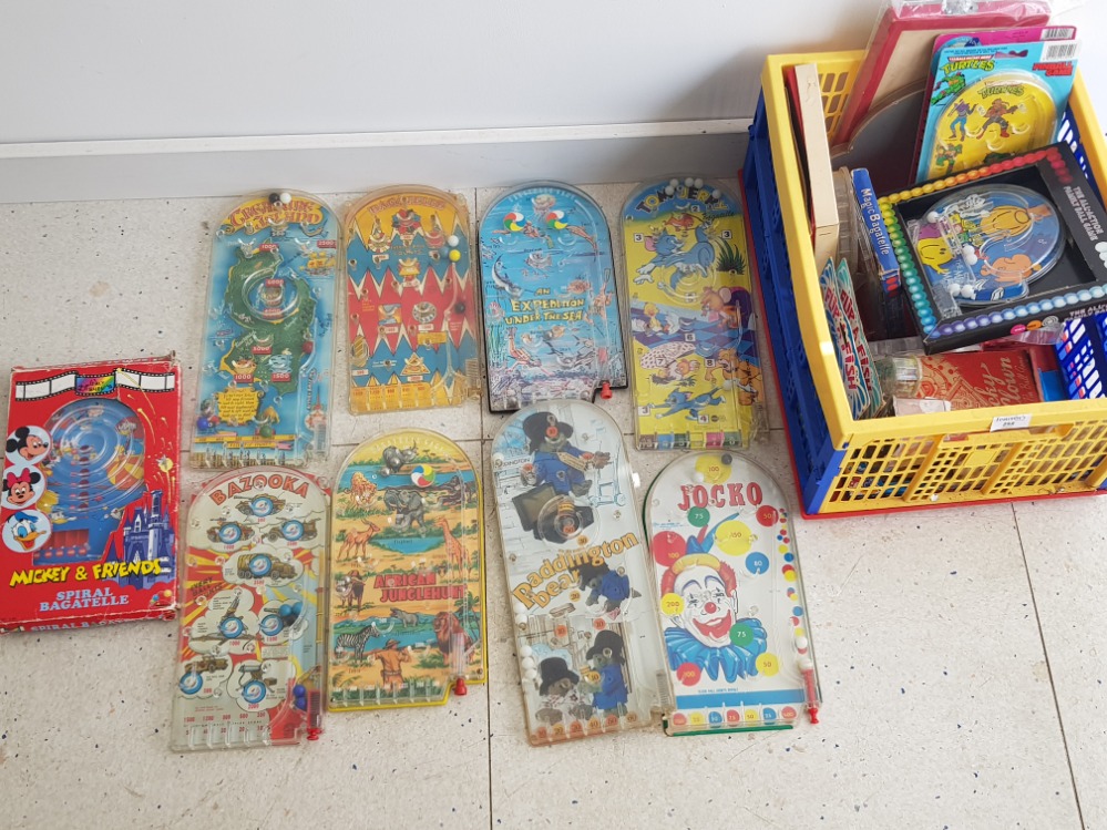 Crate containing a large Quantity of vintage novelty pinball games, includes Paddington bear, Tom