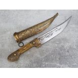 Heavy Syrian brass and horn handled knife with heavy cast decoration in similar decorative brass