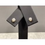 Ladies gold and Diamond solitaire stud earrings. Each approx .40ct