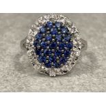 Ladies 18ct white gold Blue stone Diamond cluster ring. Size P 5.14g