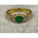 Ladies 18ct gold Emerald and Diamond ring. Featuring a round cut Emerald set in centre with 3