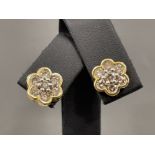 Ladies 18ct gold Diamond flower cluster studs. Featuring 7 round brilliant cut diamonds with