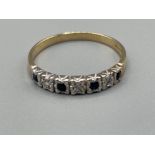 Ladies 9ct gold Sapphire and Diamond band. Featuring 4 blue sapphires and 3 diamonds. Size T 1.95g