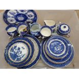 Box of blue and white willow patterned plates, cups etc also includes ringtons collectors plate