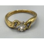 Ladies 18ct gold Diamond ring. Comprising of a marquise Diamond in centre and 4 baguettes on each