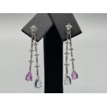 Ladies 9ct white gold stone set drop earrings. Featuring blue topaz and pink topaz set stones and