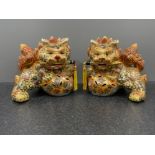 Large pair of Chinese Foo dog ornaments. 26cms x 26cms