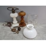 Box containing milk glass oil lamp with shade plus amber glass, glass chimneys and hanging light