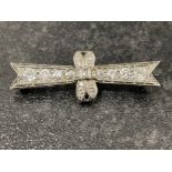 Antique ladies 18ct white gold diamond brooch. Featuring 8 graduated diamonds set across the brooch.