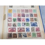 The strand stamp album containing mixed stamps from around the world, including countries Belgium,