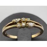 Ladies 9ct gold Diamond ring. Featuring 4 round brilliant cut diamonds and 2 marquise cut diamonds