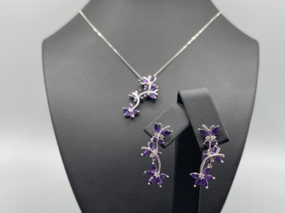 Ladies 9ct white gold Amethyst and Diamond pendant and matching earrings. Both set with a Flower