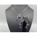 Ladies 9ct white gold Amethyst and Diamond pendant and matching earrings. Both set with a Flower