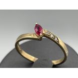 Ladies 9ct gold Ruby and Diamond ring. Featuring a marquise cut ruby and 3 round brilliant cut