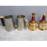 Pair of english pewter tankards with horn and nude lady handles together with a pair of Bells old