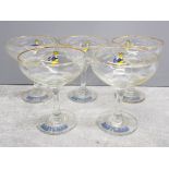 5 glass Babycham glasses, champagne saucers with fawn detail and Babycham written in blue around the