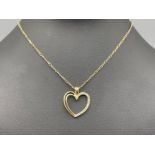 Ladies 18ct gold Diamond heart pendant and chain. Featuring 18ct gold Figaro chain with open heart