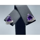 Ladies 9ct white gold Purple stone and Diamond stud earrings. Featuring a purple stone set with 4