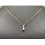 Ladies 9ct gold opal and diamond pendant. Featuring 9ct gold twist chain with opal set with 3