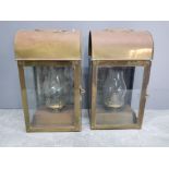 2 brass effect oil lanterns both with glazed doors and glass chimneys