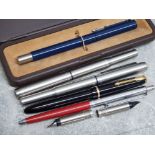 Black parker slimfold fountain pen with gold 14k nib together with 2 further parker pens, a parker