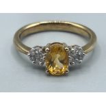 Ladies 9ct gold Citrine and diamond ring. Featuring oval citrine stone and surrounded by cluster