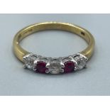 Ladies 18ct white gold 5 stone Ruby and diamond ring. Featuring 3 round brilliant cut diamonds and