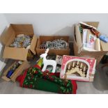 A large quantity of Christmas decorations to include lights, figurines, rug, tinsel etc