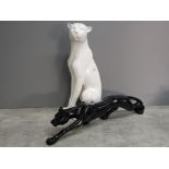 2 large Jaguar ornaments, all white sitting height 59cm and all black prowling lenght 74cm