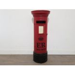 A metal cupboard in the form of a post box 97cm high.