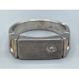 Gents 18ct white gold diamond Cartier style ring. Comprising of a Round brilliant cut diamond with